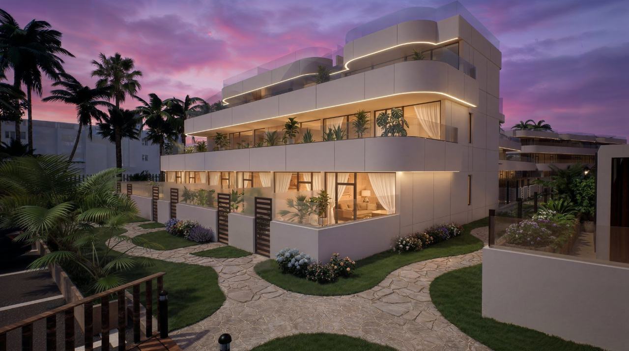 Apartment building with landscaped gardens at dusk