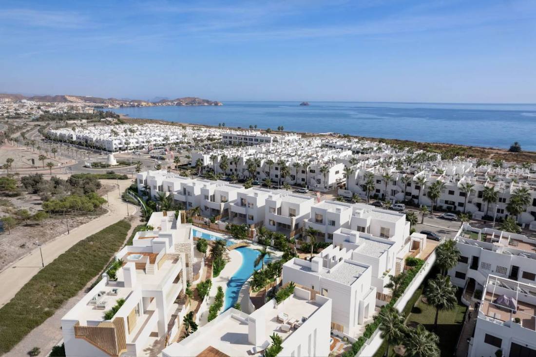 Aerial view of the development with the coastline beyond
